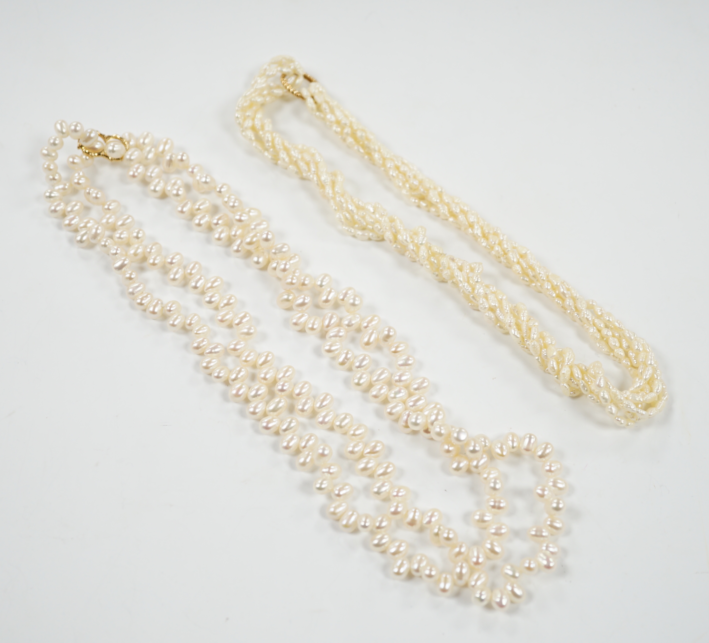 A double strand freshwater pearl necklace, with 585 yellow metal clasp, 50cm and one other freshwater pearl necklace with 585 yellow metal clasp.